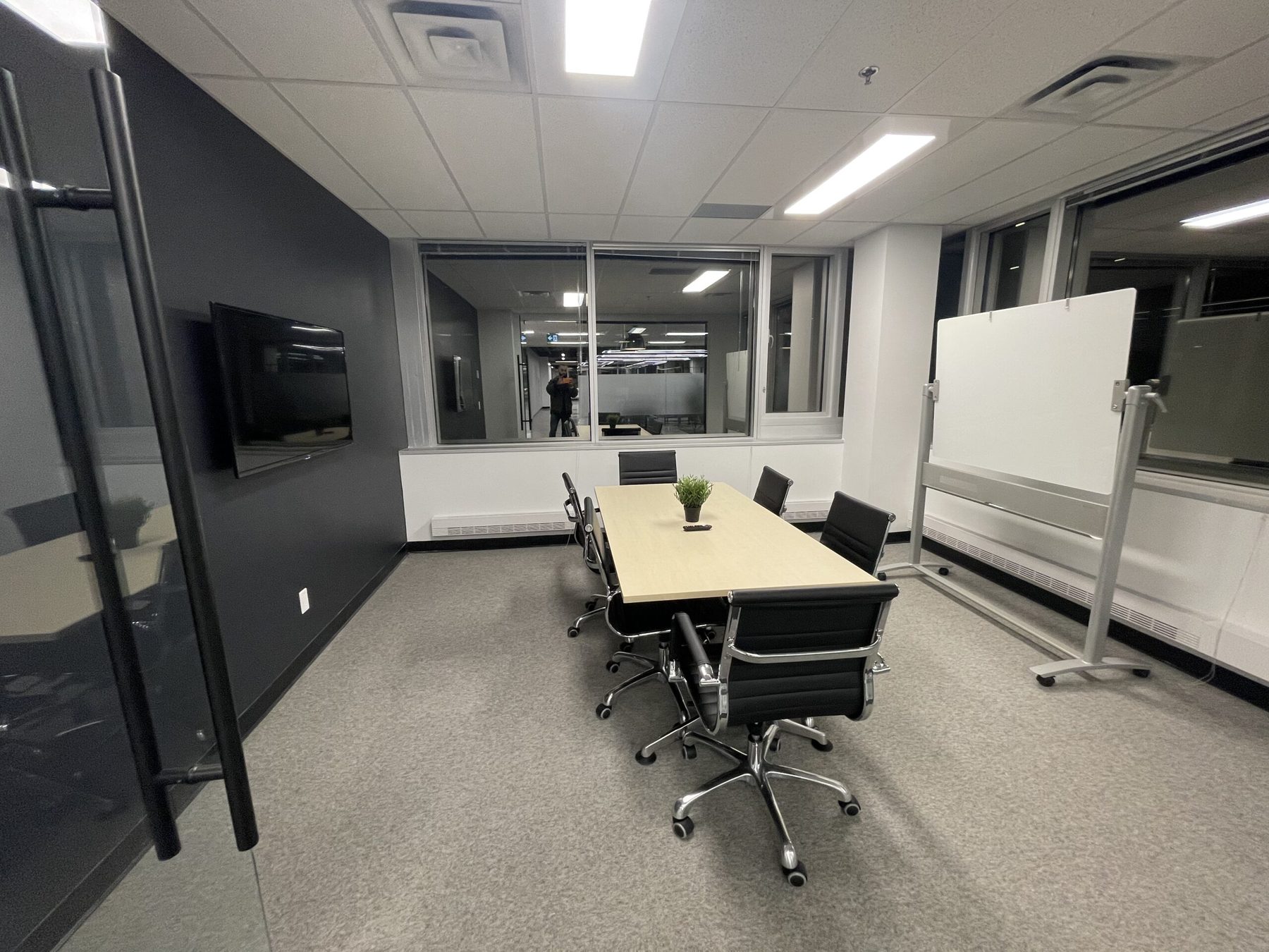 Boardroom with a long table and glass walls