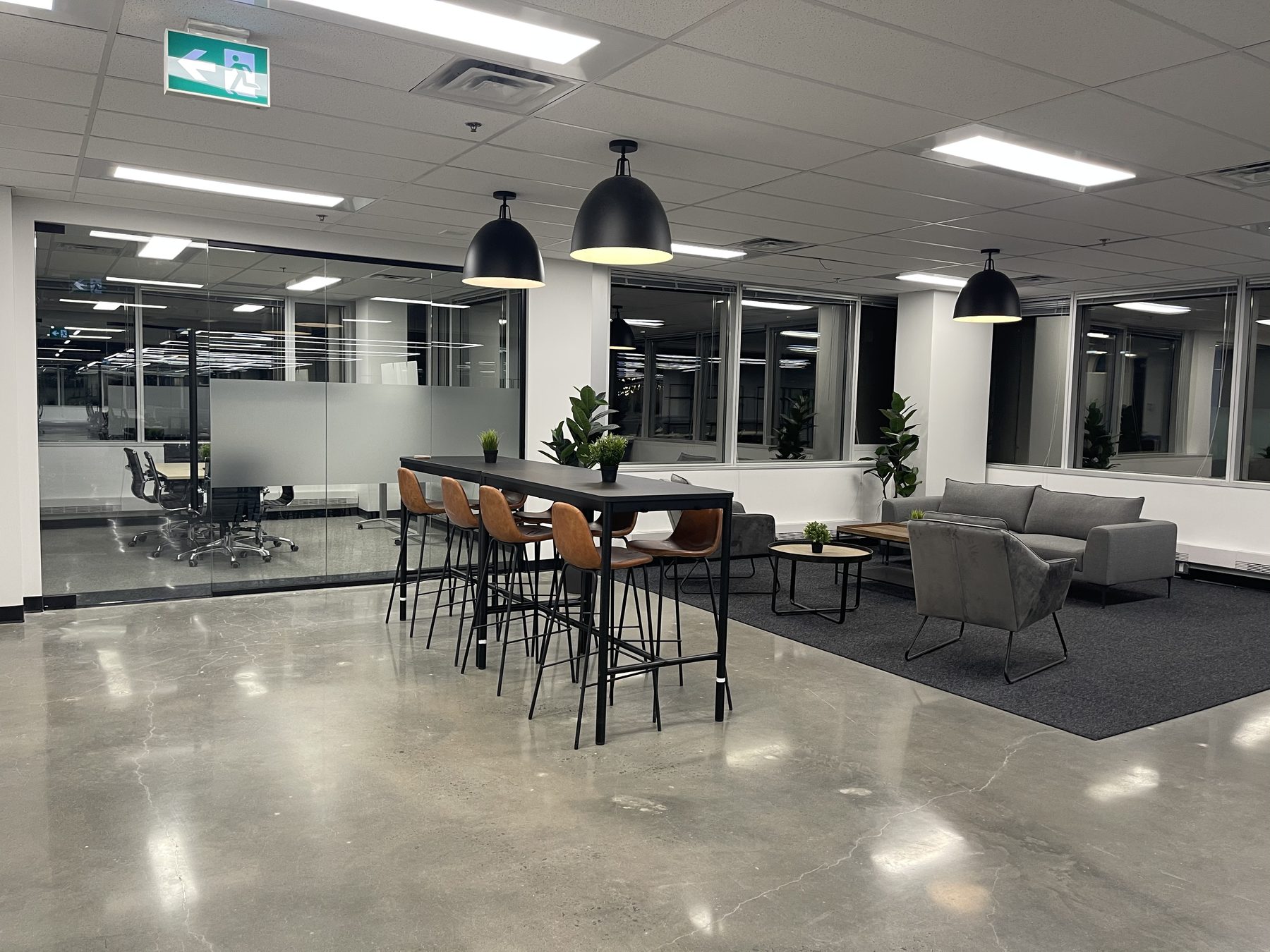 Completed office workstations under linear lighting