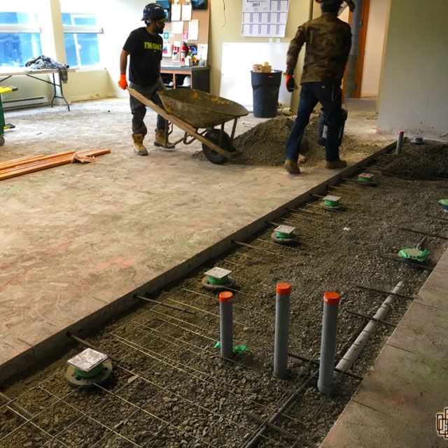 Crew placing rebar ahead of a concrete pour