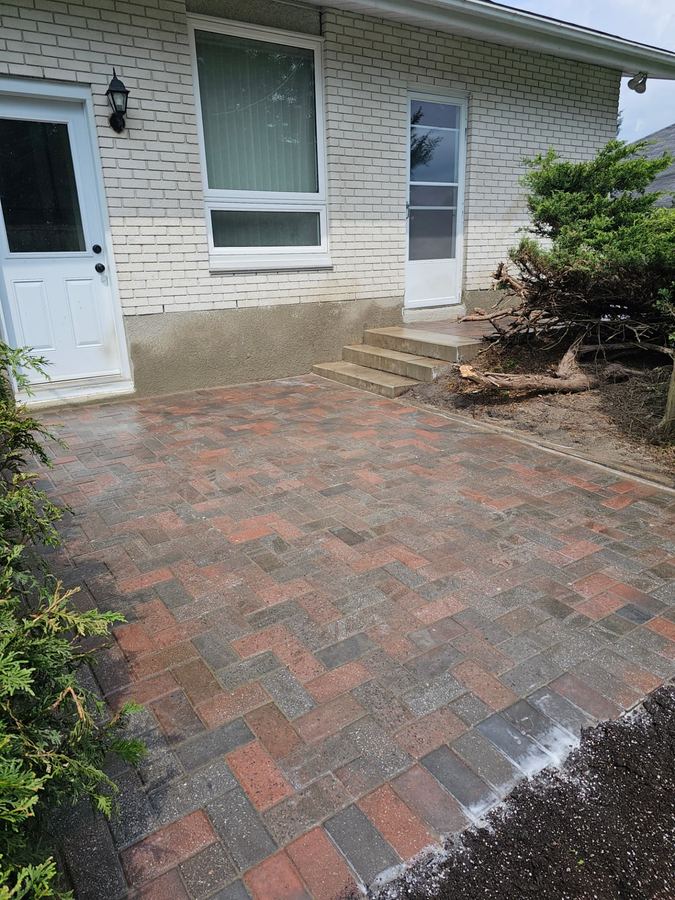 Interlock walkway leading to a front entry