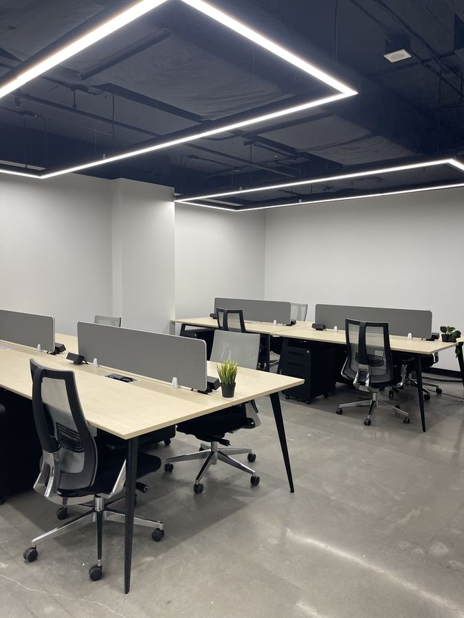 Office desking under linear lights