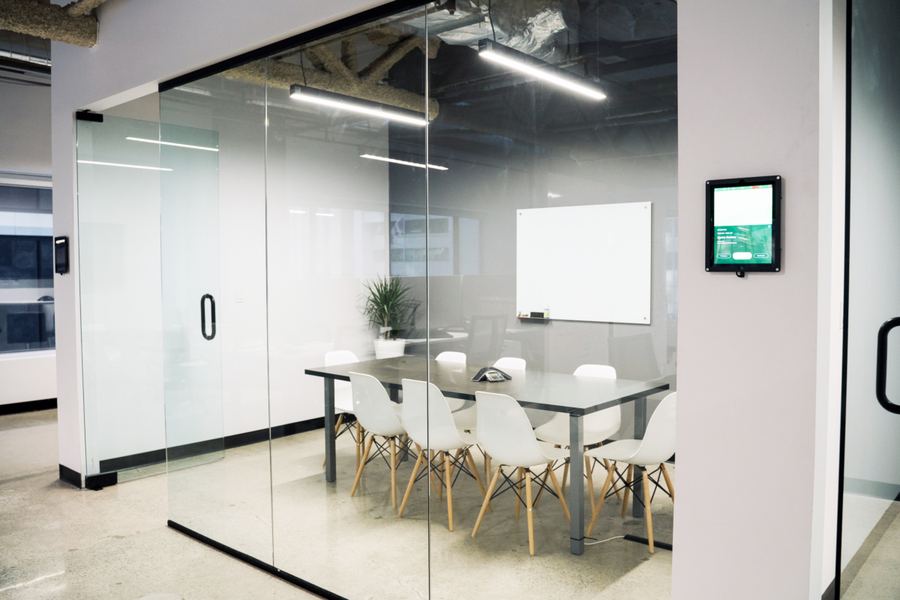 Glass-walled conference room in a finished office
